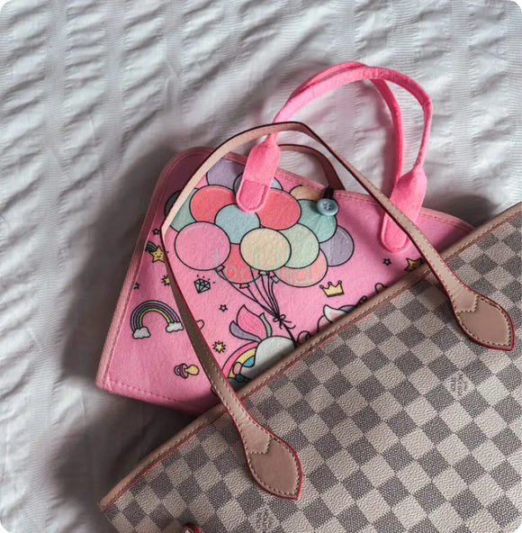 The Busy Board folded shut inside a diaper bag